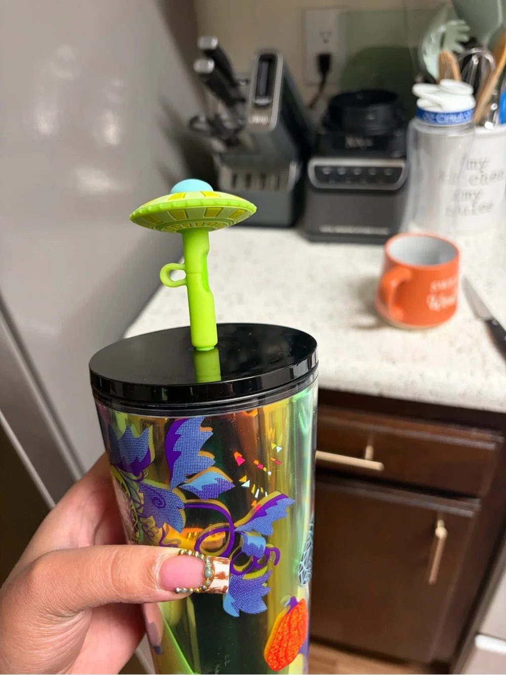 Starbucks Iridescent Tumbler with Neon Green Lid and Multi-Color Fruit Motifs